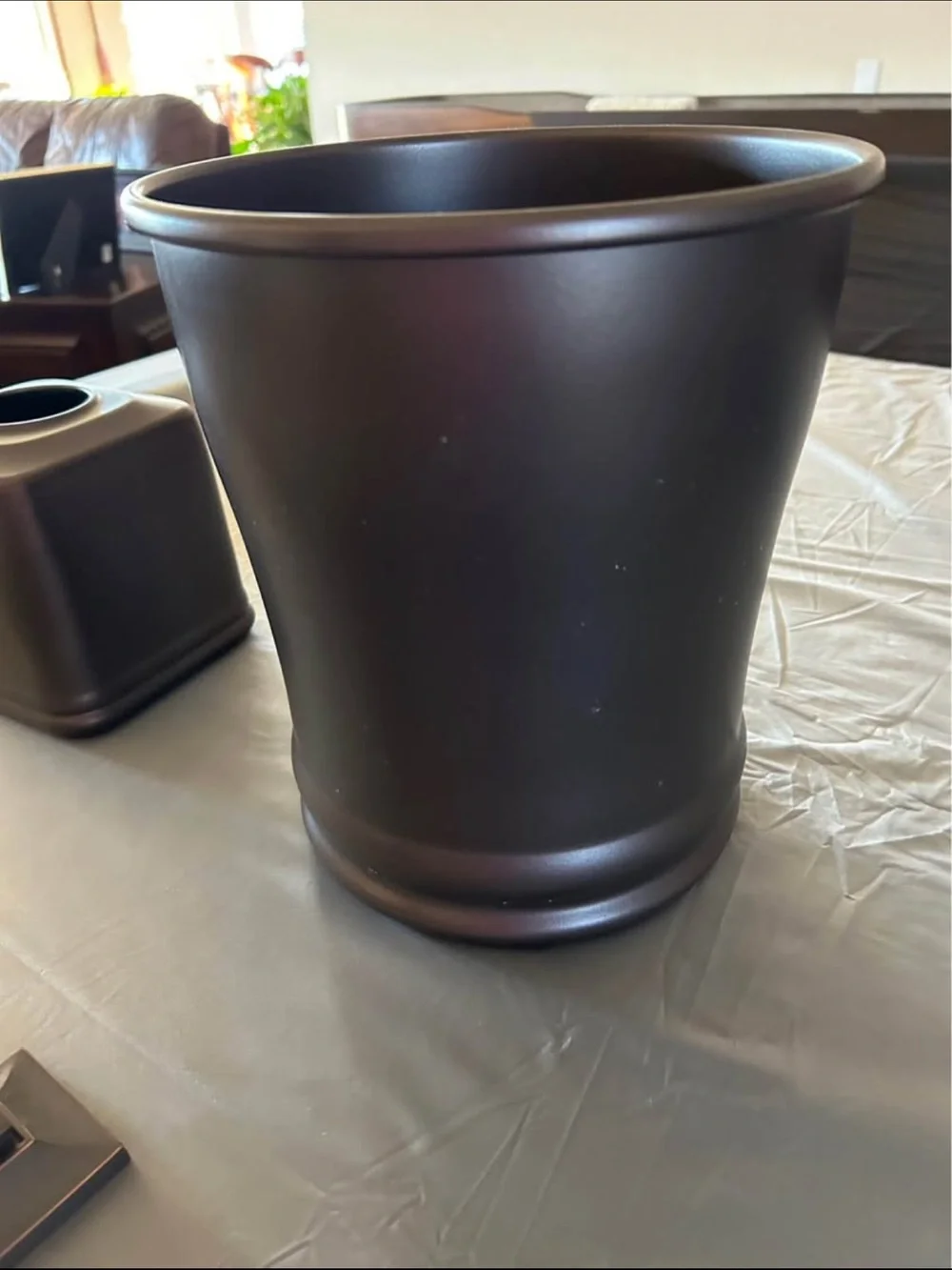 Restoration Hardware toilet paper holder with other accessories.